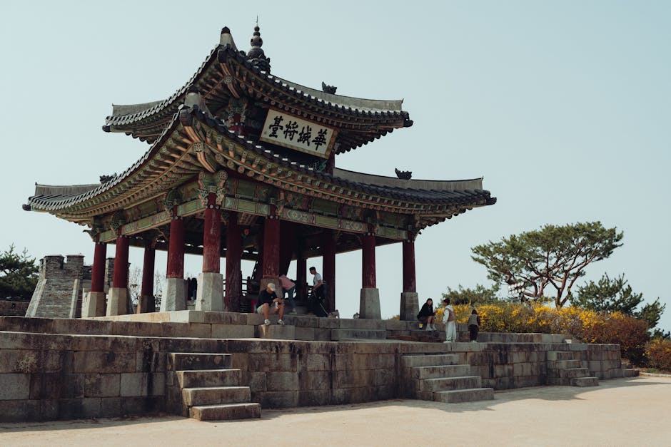Explore a traditional Korean pavilion in Seoul, embraced by spring blooms.
