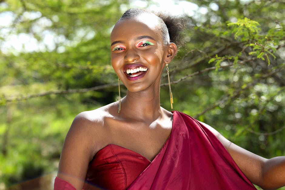 Bright and cheerful portrait of a woman in traditional clothing, enjoying a sunny day outdoors.