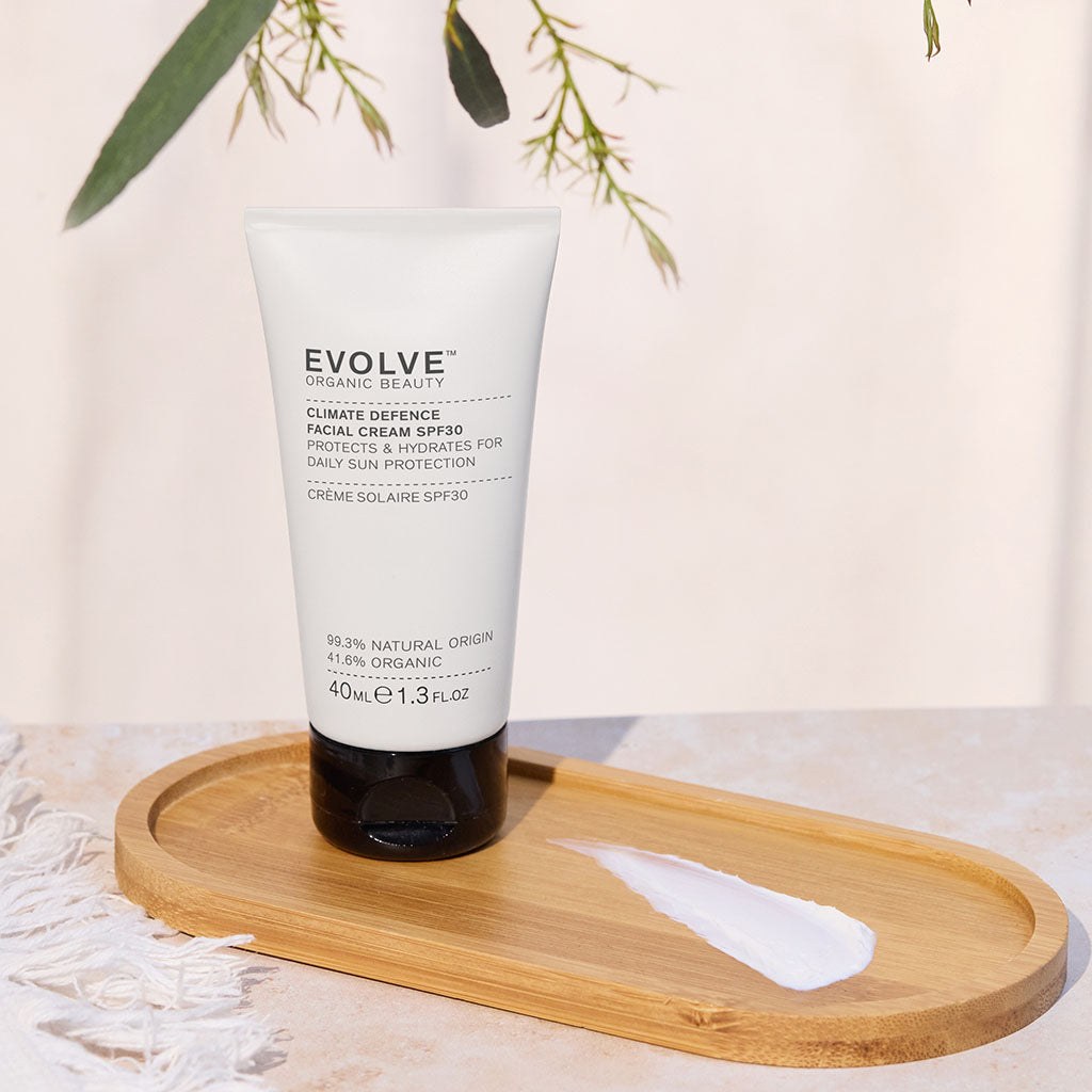 Evolve Climate Defence Facial Cream SPF 30 displayed on a wooden tray