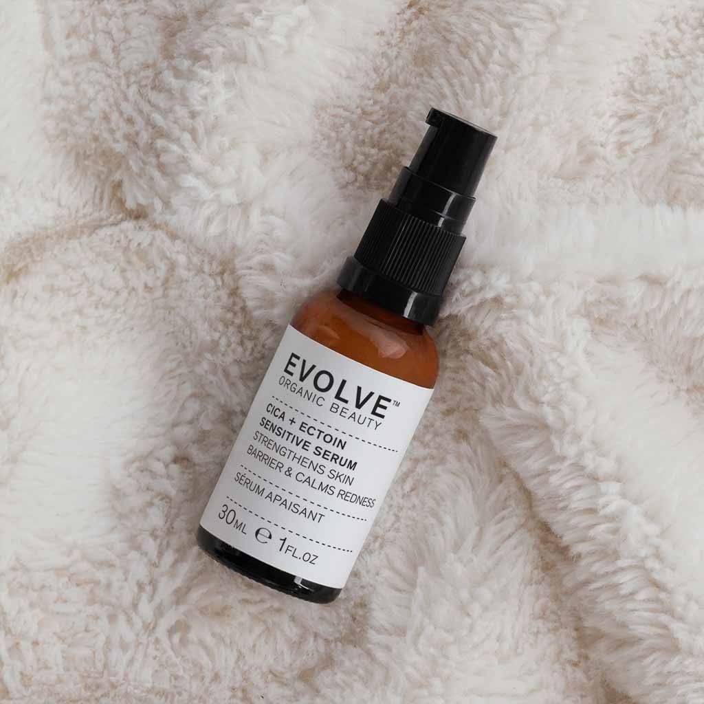 Evolve CICA and Ectoin Sensitive Serum bottle resting on a soft towel