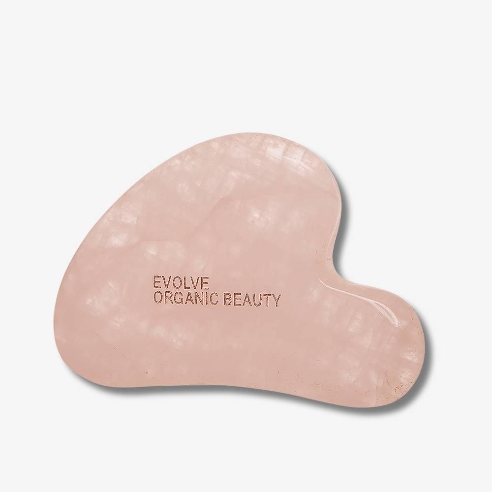 Pink Evolve Rose Quartz Gua Sha on a white background