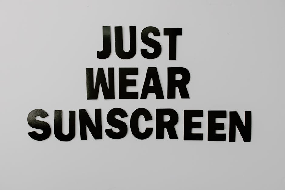 Bold black text saying 'Just Wear Sunscreen' on a white background.